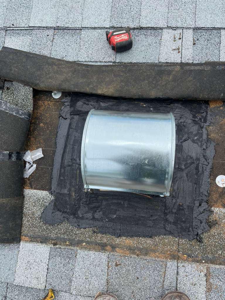 Goose-neck vent flashing plate fully sealed in modified bitumen mastic on a Broward County shingle roof