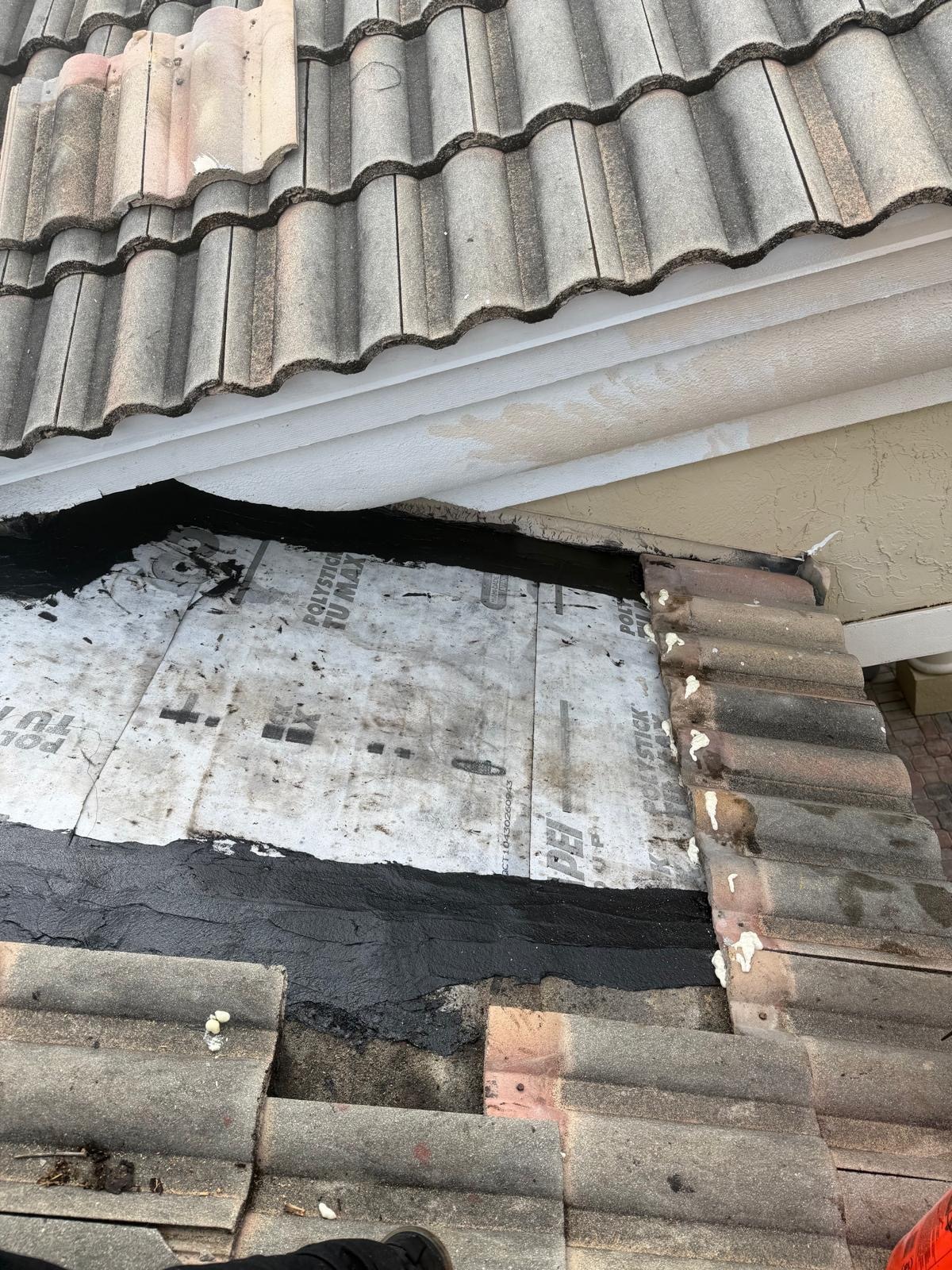 Underlayment lapped and sealed into the eave and valley detail on a Florida tile roof repair