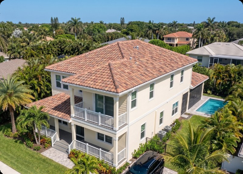 Aerial view of a South Florida home with a tile roof after a storm