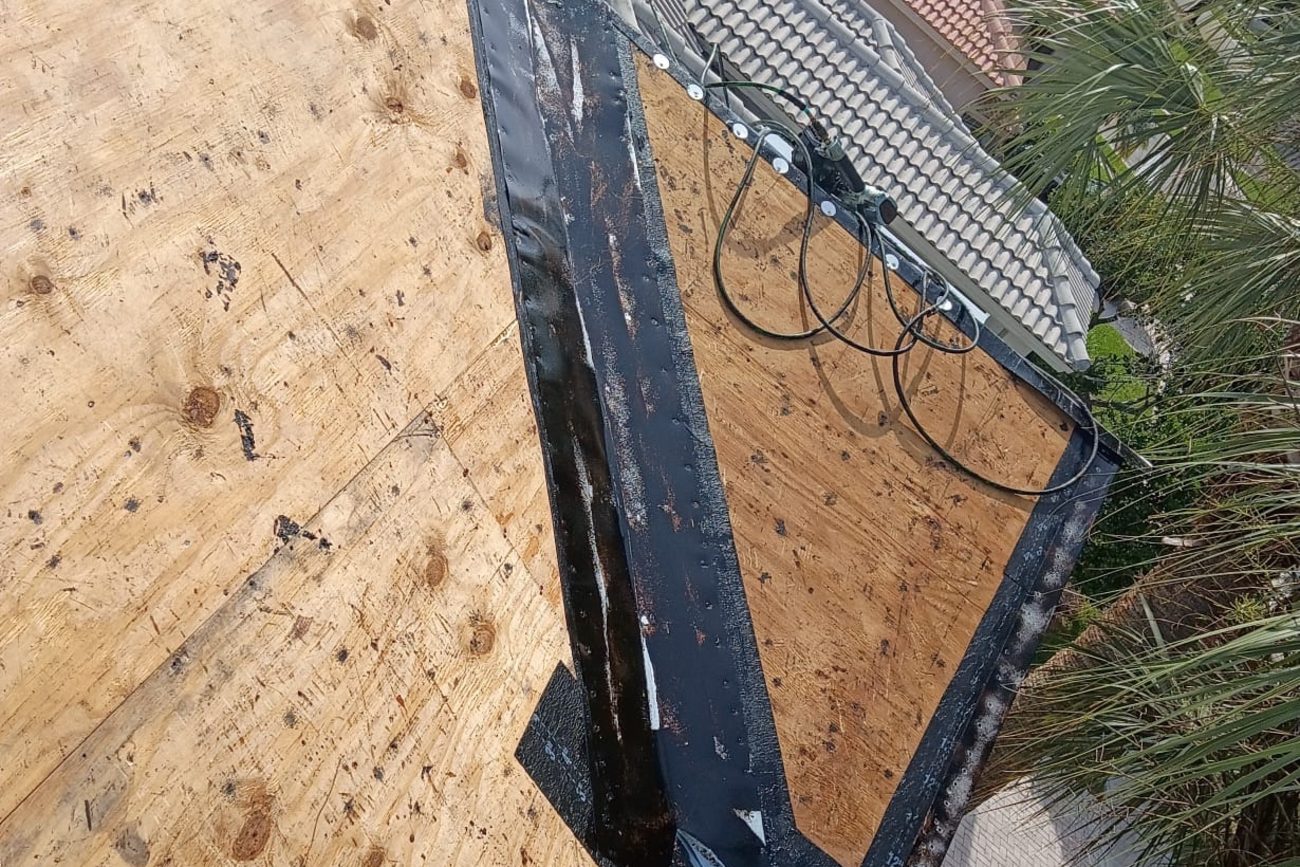 New valley and eave metal set in mastic on a bare plywood roof deck
