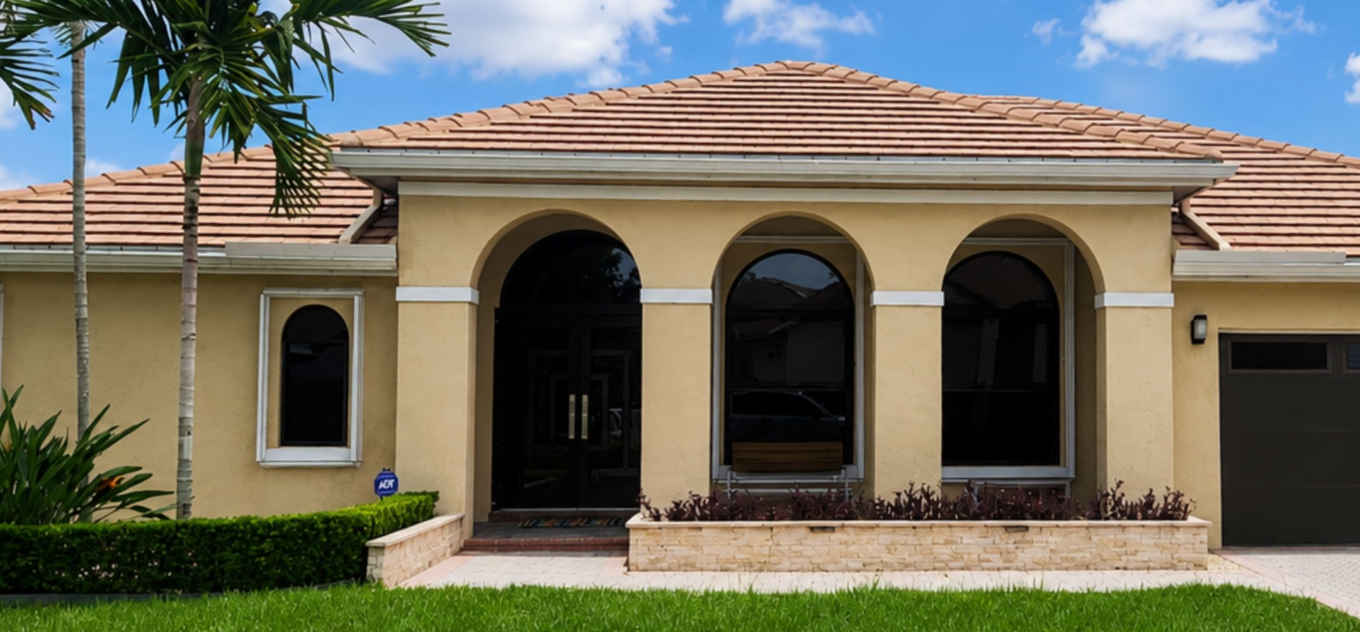 Barrel tile roof and arched entry on a SilverLakes home in Pembroke Pines FL