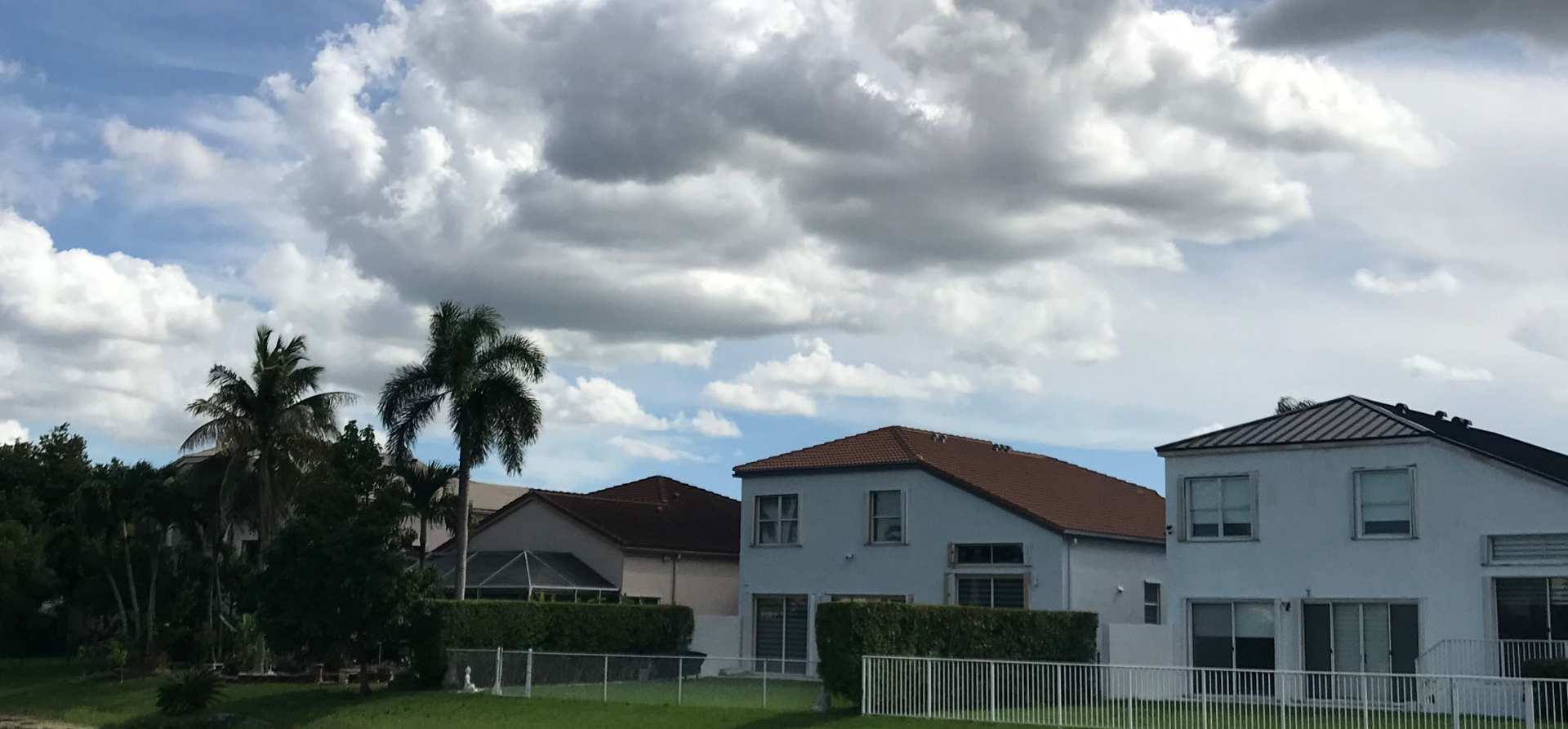 Lakefront homes with tile and metal roofs in Towngate, Pembroke Pines FL