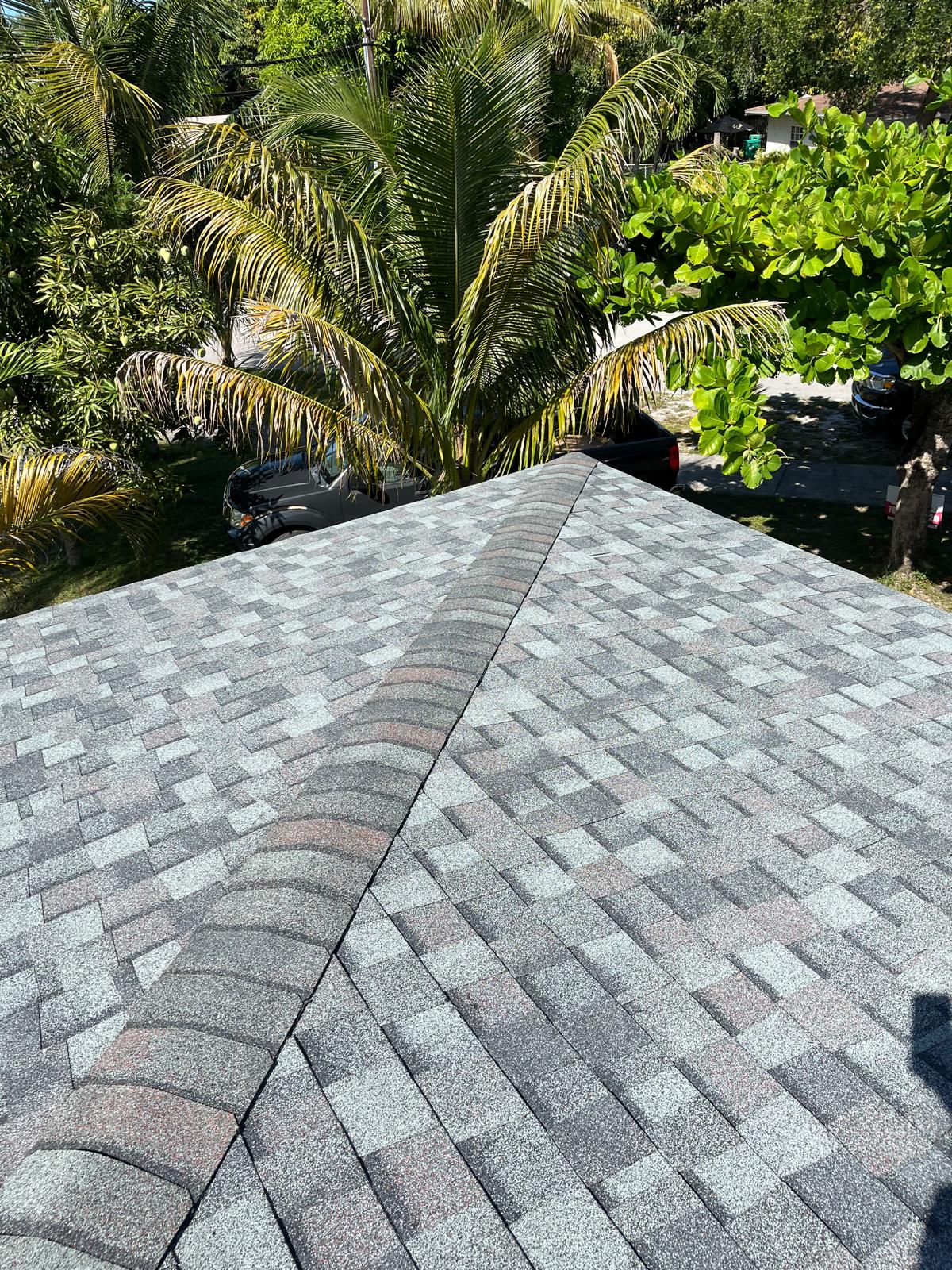 Completed blended colour architectural shingle roof with hip and ridge detail in Broward County, Florida