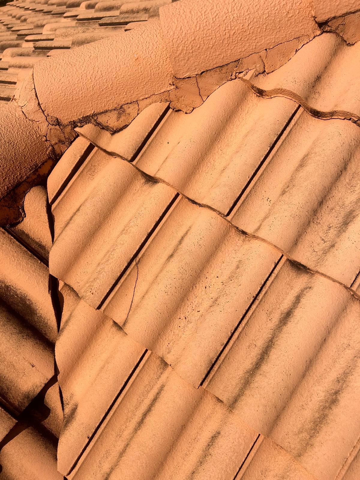 Broken ridge and field tiles on a concrete tile roof in Broward County, Florida
