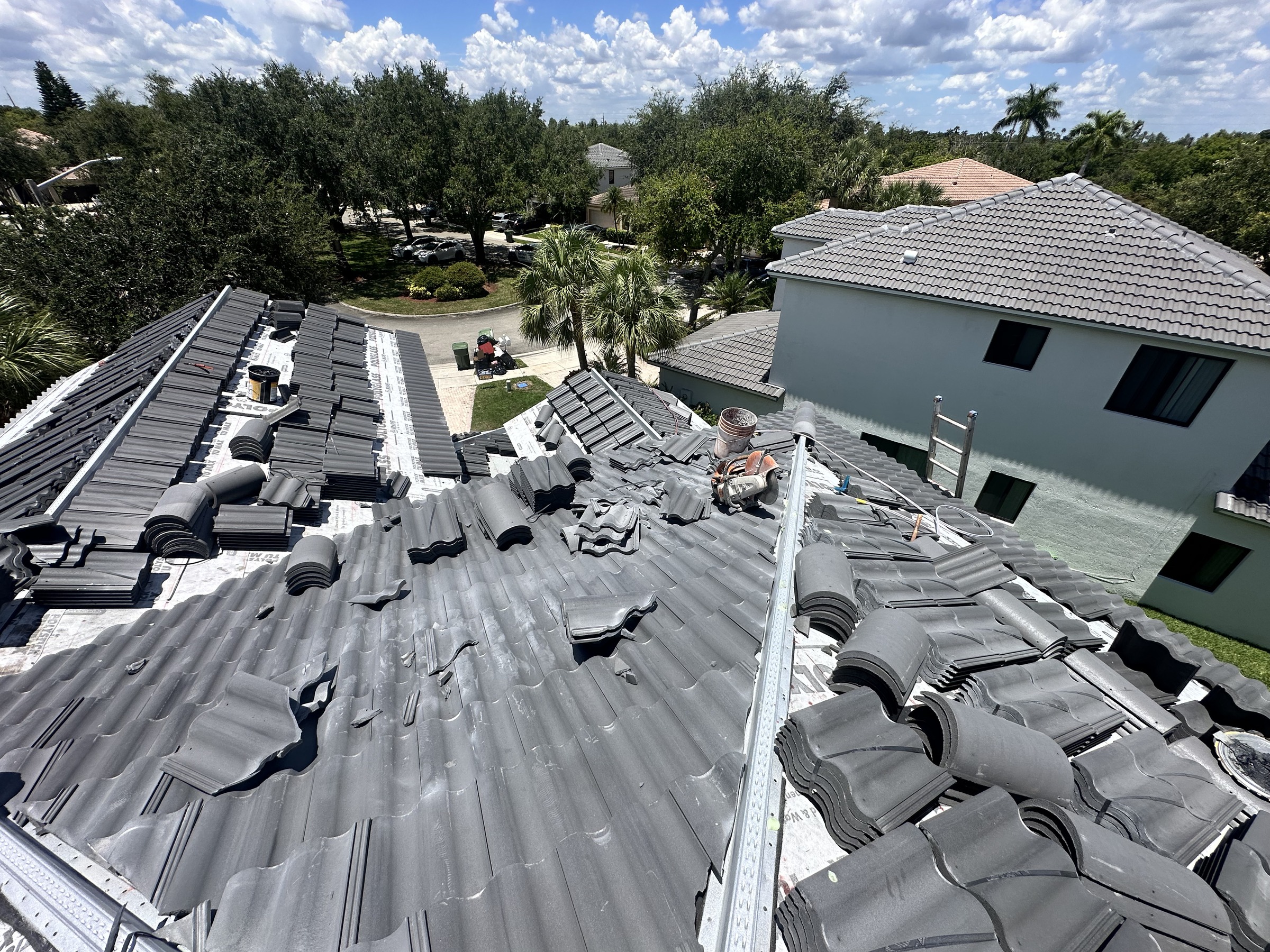 Polyglass peel and stick underlayment installed with concrete tiles staged on a Broward County, Florida roof