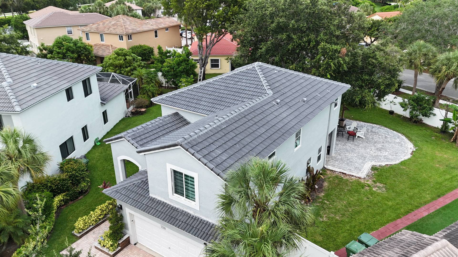 Completed grey concrete tile roof photographed from above in Broward County, Florida