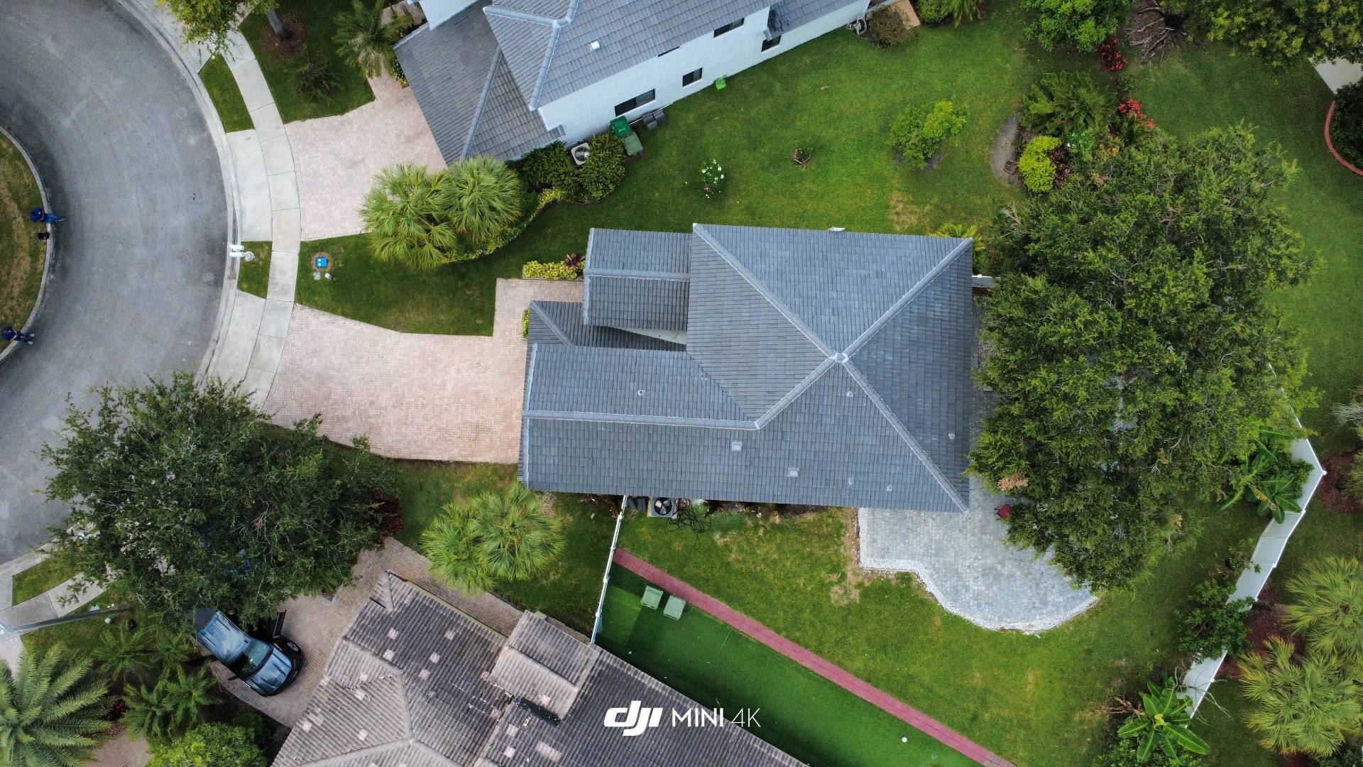 Completed grey concrete tile roof photographed directly overhead in Broward County, Florida