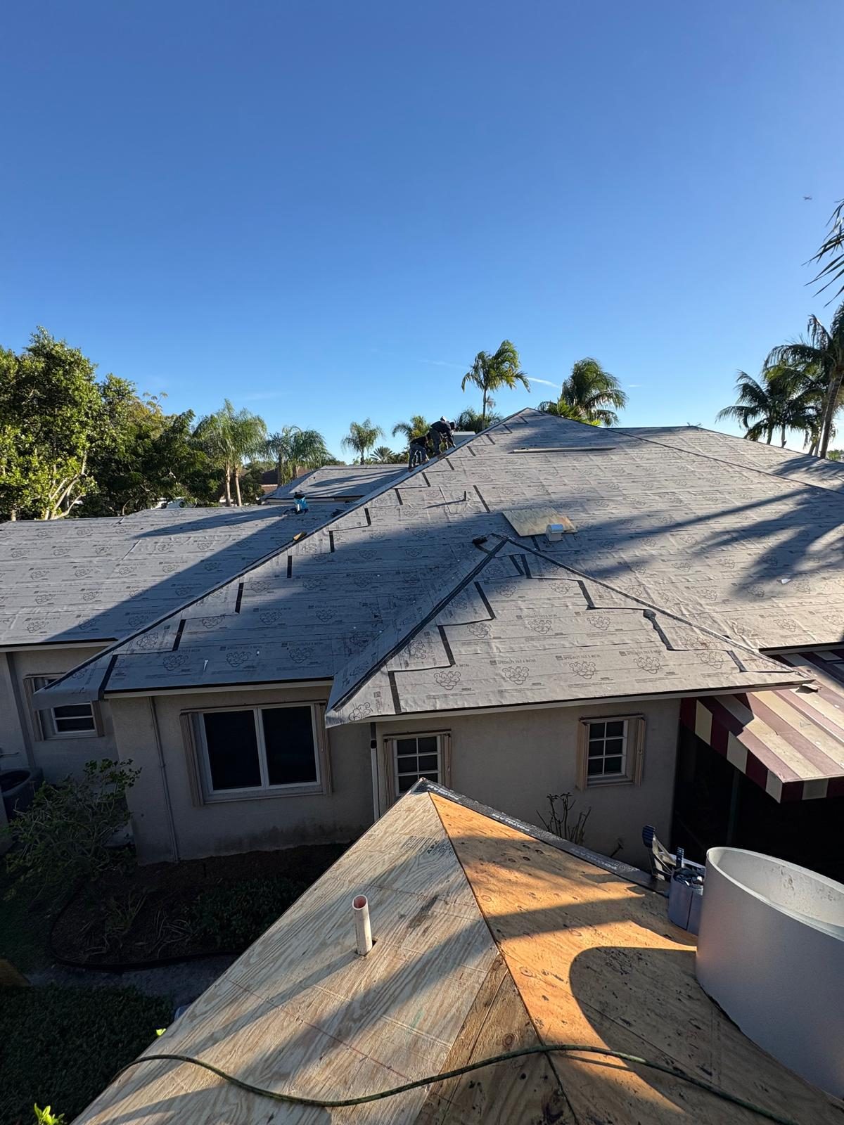 Completed Polyglass Polystick XFR dry-in across a Broward County shingle roof deck, edges and valleys sealed
