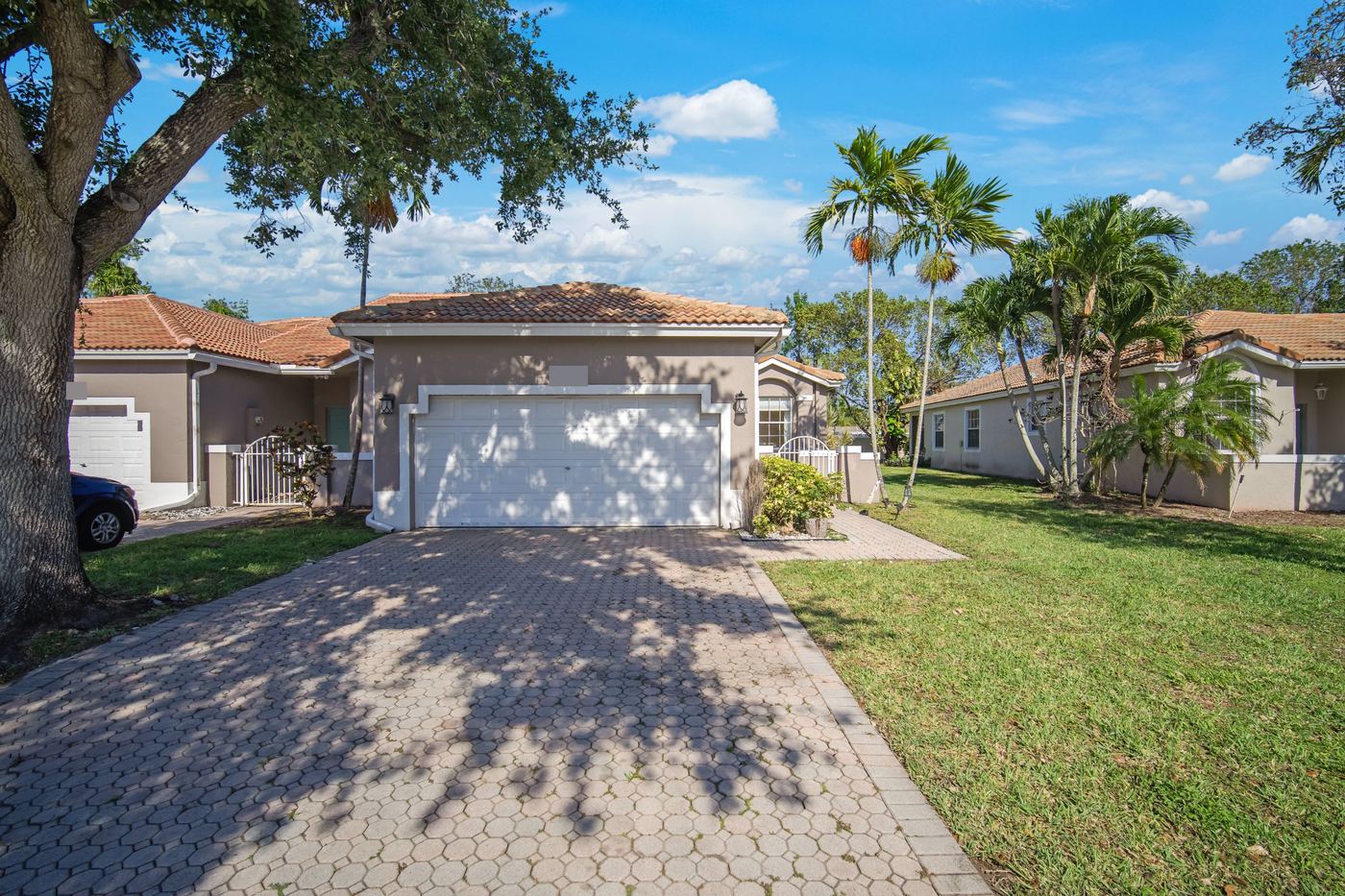 Terracotta concrete tile roof over a two-car garage in a Fort Lauderdale, Florida community