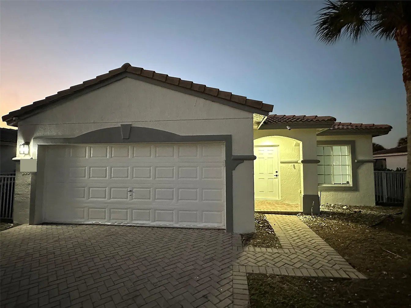 Concrete tile gable roof over a two-car garage in Miramar, Florida