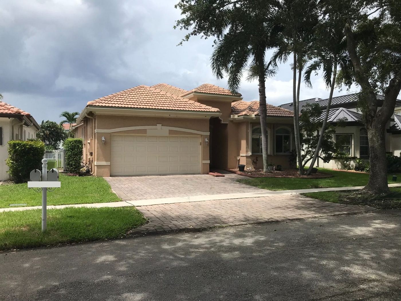 Single-story home with a terracotta concrete tile roof in Miramar, Florida
