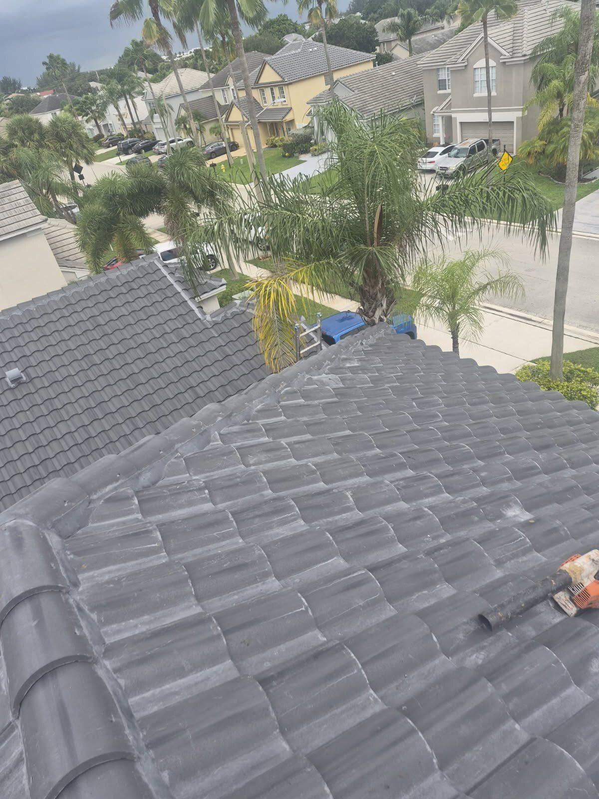 New charcoal barrel tile roof field on a Tamarac, Florida home looking out over the street
